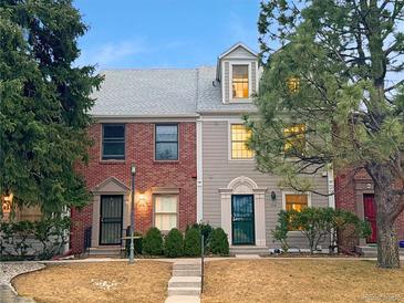 Charming townhomes featuring brick and siding exteriors with well-maintained landscaping and inviting entrances at 5708 E 10Th Ave, Denver, CO 80220