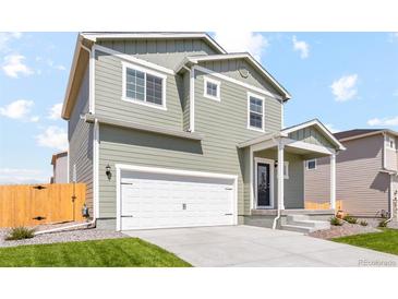 Charming two-story home with a spacious two-car garage and a welcoming front porch at 7303 Dolores Ave, Frederick, CO 80530
