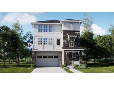 Striking two-story home with stone accents, attached garage, and a light and airy color palette at 6747 E 149Th Dr, Thornton, CO 80602