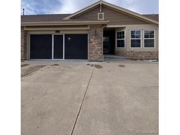 Inviting single-Gathering home featuring a neutral palette, a two-car garage, and low-maintenance landscaping at 15217 Xenia, Thornton, CO 80602