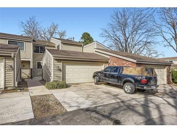 Charming townhome featuring a two-car garage and well-maintained landscaping at 7925 W Layton Ave # 529, Littleton, CO 80123