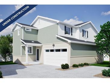 Charming two-story home featuring a neutral color palette, attached two car garage, and professionally designed landscaping at 22361 E 38Th Pl, Aurora, CO 80019