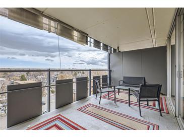 Inviting outdoor balcony featuring a table and chairs, perfect for relaxing and enjoying the views at 790 N Washington St # 804, Denver, CO 80203