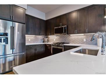 Modern kitchen featuring stainless steel appliances, sleek countertops, and stylish cabinetry at 20 Wilcox St # 621, Castle Rock, CO 80104
