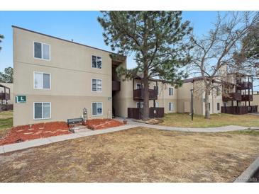 Inviting apartment complex exterior with well-maintained landscaping and mature trees at 9995 E Harvard Ave # 166, Denver, CO 80231