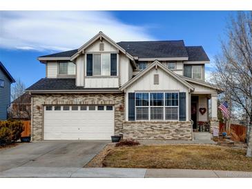 Charming two-story home featuring a brick facade, attached garage, and well-maintained landscaping at 1995 E 166Th Ave, Thornton, CO 80602