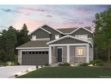 Two-story Craftsman style home with gray siding and landscaping at 4306 Canyata Dr, Elizabeth, CO 80107