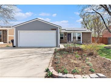 Charming single-Gathering home features a two-car garage, brick, and gray siding exterior at 12418 Albion St, Thornton, CO 80241