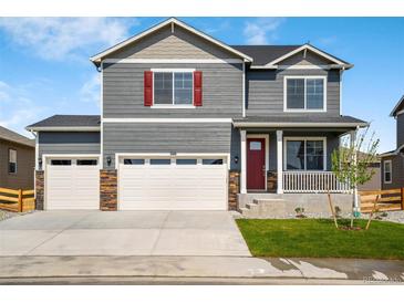 Charming two-story home with a three car garage and a welcoming front porch and red shutters at 3514 Belleville Ridge Rd, Elizabeth, CO 80107