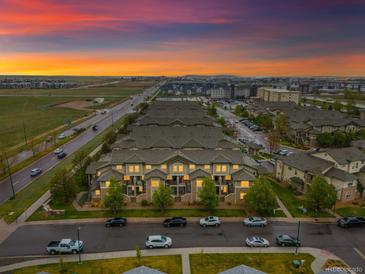 Stunning aerial view of townhome community featuring lush landscaping and convenient parking at 5800 Tower Rd # 610, Denver, CO 80249