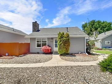 Gray house with stone accents and a small, landscaped front yard at 12780 E Bethany Pl, Aurora, CO 80014