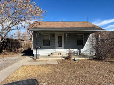 Charming single-story home with a cozy front porch and a well-maintained yard at 2915 W 4Th Ave, Denver, CO 80219