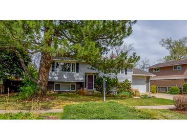 Charming home featuring a well-maintained front yard with mature trees and lush landscaping at 790 Mohawk Dr, Boulder, CO 80303
