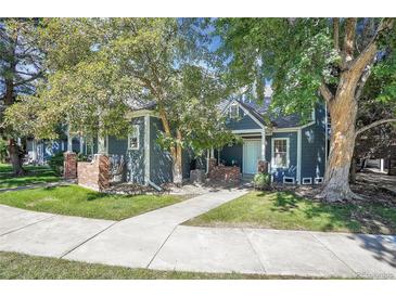 Charming townhome with welcoming front porch and mature trees at 11127 Alcott St # A, Denver, CO 80234