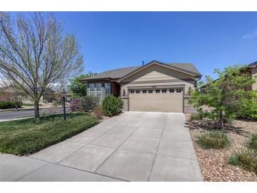 Charming single-Gathering home featuring a well-maintained lawn, and a two-car garage in a suburban neighborhood at 8255 E 150Th Pl, Thornton, CO 80602