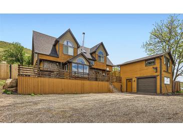 Unique multi-level exterior with wood and stone details at 220 Wark Ave, Berthoud, CO 80513