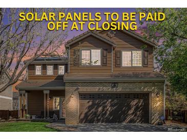 Charming two-story home with a well-maintained yard and solar panels paid off at closing at 19681 E 59Th Pl, Aurora, CO 80019