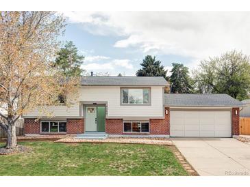 Charming two-story home features a manicured lawn, brick accents and attached two car garage at 9380 Raleigh Ct, Westminster, CO 80031