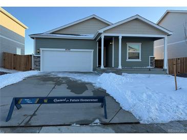 Charming single-Gathering home with a two-car garage and covered porch, perfect for future homeowners in a great neighborhood at 48280 Shetland Dr, Bennett, CO 80102