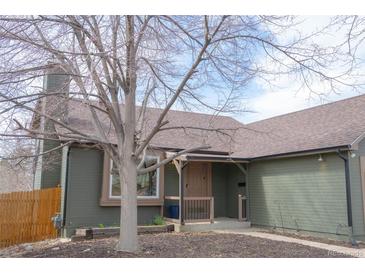 Charming single-story home featuring a well-maintained yard and covered front porch at 3943 S Espana St, Aurora, CO 80013