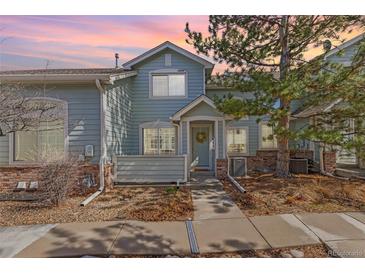 Charming two-story townhome with a welcoming entrance and well-maintained landscaping at 9604 Brentwood Way # B, Broomfield, CO 80021