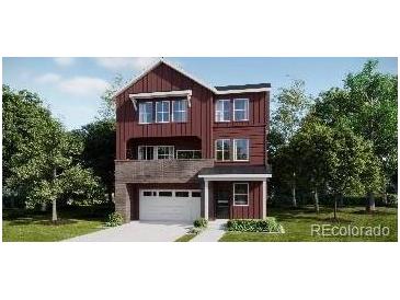 A charming two-story home with a brick and siding facade, plus a white garage door at 8847 Waterleaf Ln, Littleton, CO 80125