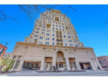 Upscale high-rise condo building with an elegant stone and beige facade and private balconies at 300 W 11Th Ave # 8C, Denver, CO 80204