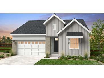 Charming single-Gathering home featuring vertical siding and a two-car garage, blending modern design with comfort at 17055 W 92Nd Loop, Arvada, CO 80007