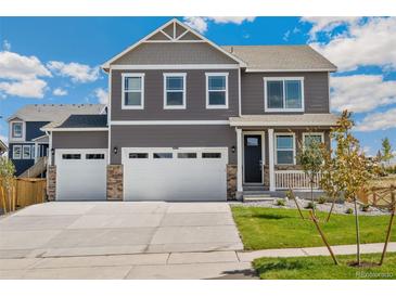 Two-story house with gray siding, white trim, and a three-car garage at 13455 Valentia Pl, Thornton, CO 80602