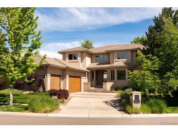 Stately two-story home boasts a well-manicured lawn, mature trees, and a spacious three-car garage at 2535 W 115Th Dr, Westminster, CO 80234
