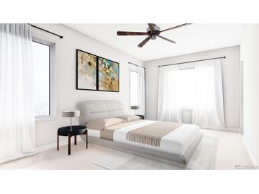 Bright bedroom with a large bed, neutral decor, and natural light from large windows at 81 N Meade St, Denver, CO 80219