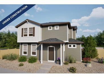 Charming two-story home with gray siding, white trim, and professionally landscaped front yard at 46533 Sunflower Ln, Bennett, CO 80102