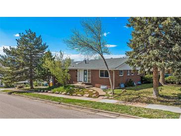 Charming single-story brick home with well-manicured landscaping and mature trees enhancing curb appeal at 295 E Amherst Ave, Englewood, CO 80113