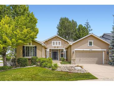 Charming single-Gathering home featuring a well-maintained lawn and inviting front entrance at 10050 Eagle Valley Way, Highlands Ranch, CO 80129