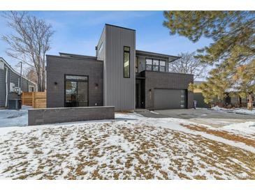 Modern two-story home with gray siding and a spacious driveway at 3289 S Eudora St, Denver, CO 80222