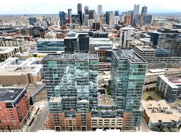Stunning aerial view showcasing a modern high-rise apartment building with city skyline views at 1700 Bassett St # 314, Denver, CO 80202
