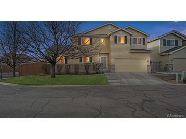 Charming two-story home with a well-maintained lawn and attached garage, perfect for suburban living at 10121 Wyandott Cir, Thornton, CO 80260