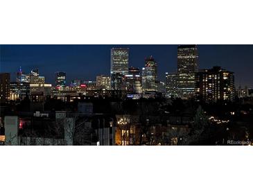 Night view of Denver with illuminated high-rise buildings against a dark sky, a stunning urban panorama at 800 N Washington St # 710, Denver, CO 80203
