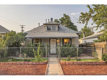 Charming home featuring a well-maintained front yard, gray shingle roof, and chain-link fence at 2831 W Irvington Pl, Denver, CO 80219