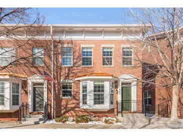 Charming brick townhouse with bay window and well-maintained front yard, perfect for urban living at 11905 Quitman St, Westminster, CO 80031