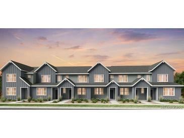 Charming row of two-story townhomes featuring modern architecture and inviting entrances at 17125 W 91St Ln, Arvada, CO 80007