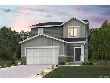 Charming two-story home with a two-car garage, neutral color palette, and welcoming front porch at 2178 Flower Blossom Ave, Brighton, CO 80601
