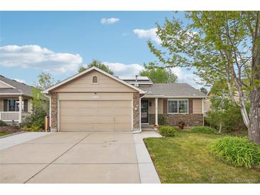 Charming single Gathering home with a well-maintained lawn and a two-car garage at 12753 Buckhorn Creek St, Parker, CO 80134