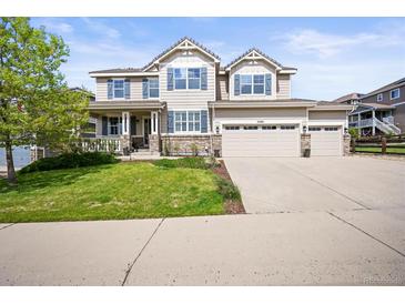 Beautiful two-story home with a three-car garage and manicured lawn in a desirable neighborhood at 2090 Bellavista St, Castle Rock, CO 80109