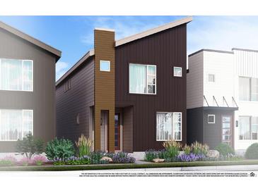 Modern two-story home with a combination of vertical and horizontal paneling and simple landscaping at 1577 W 166Th Ave, Broomfield, CO 80023