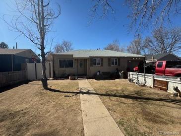 Charming single-story home with mature tree and spacious front yard at 1171 Geneva St, Aurora, CO 80010