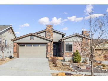 Ranch style home with stone accents and a two-car garage at 12597 W Big Horn Cir, Broomfield, CO 80021