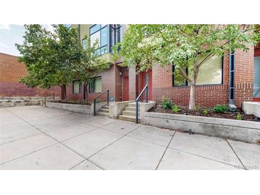 Brick building with landscaped courtyard and private entrance at 2345 Walnut St # 28, Denver, CO 80205