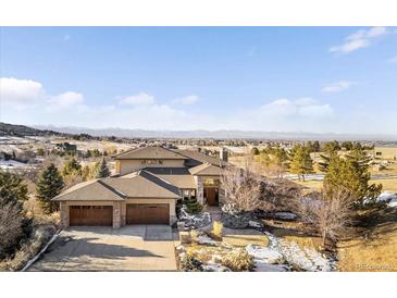 Expansive home with a three car garage and mountain views at 10370 Grande Vista Ct, Lone Tree, CO 80124