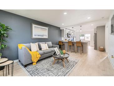Inviting living room showcases an open layout, modern furnishings, and stylish decor at 5721 W 92Nd Ave # 96, Westminster, CO 80031